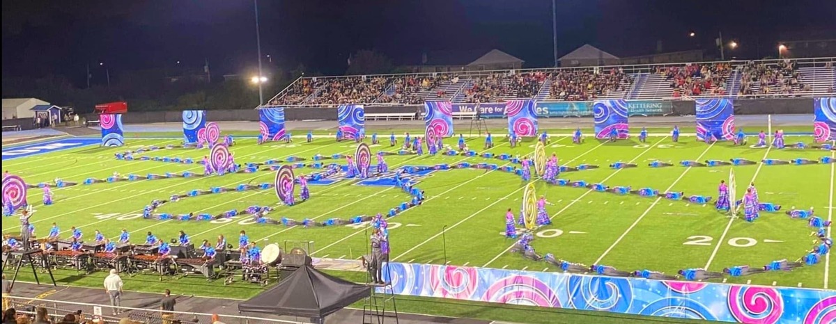 marching band on field making rope shape