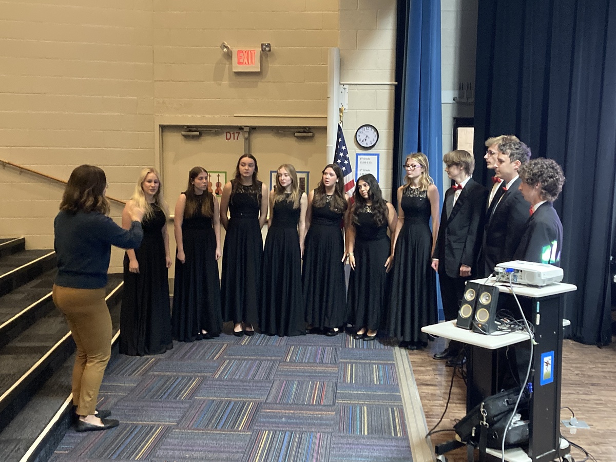 The Turpin High School Chamber Choir performs at the Board of Education meeting.