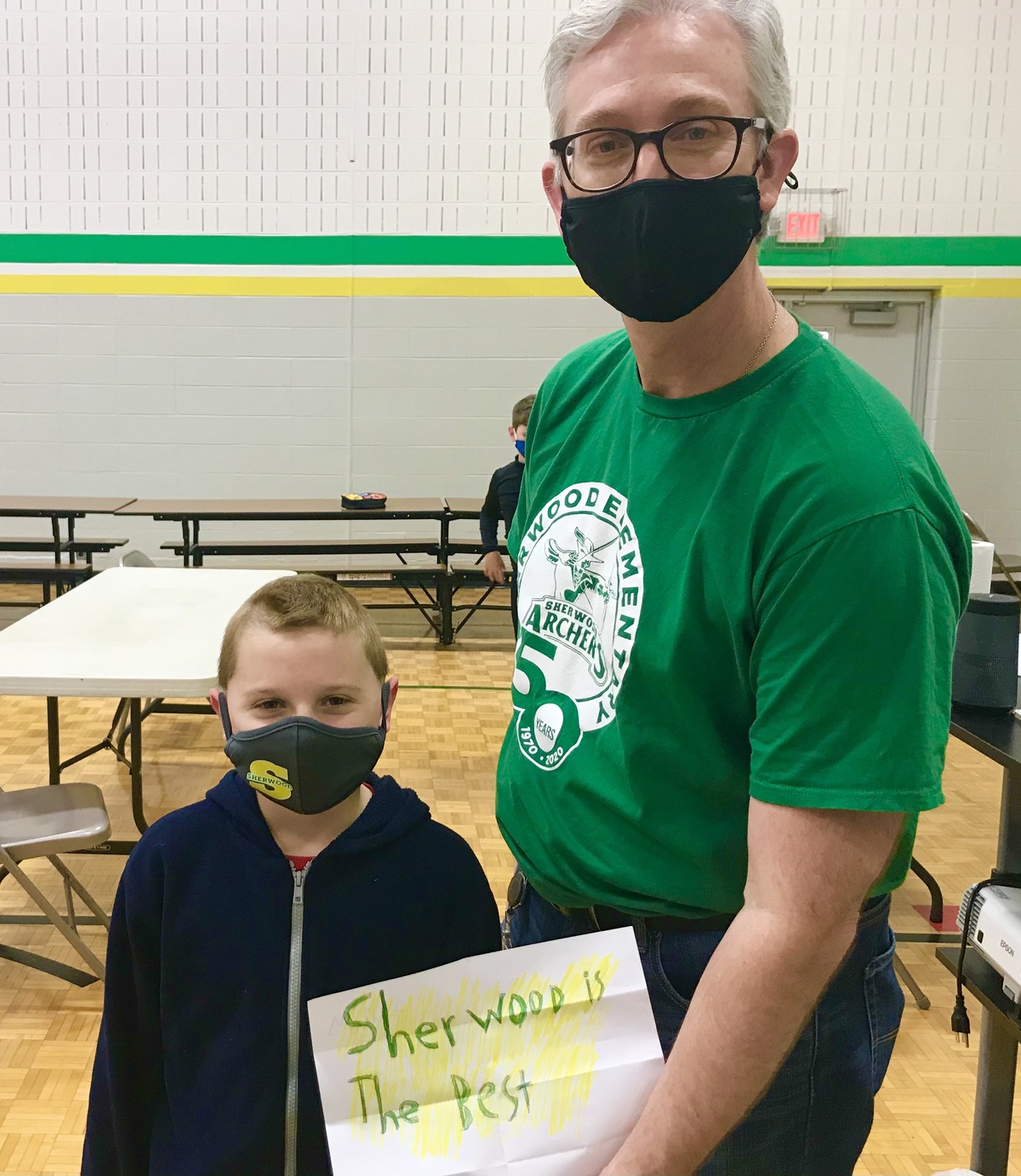 Man and student with drawing "Sherwood is the best"